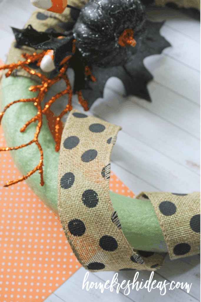 wrapping wreath with burlap ribbon