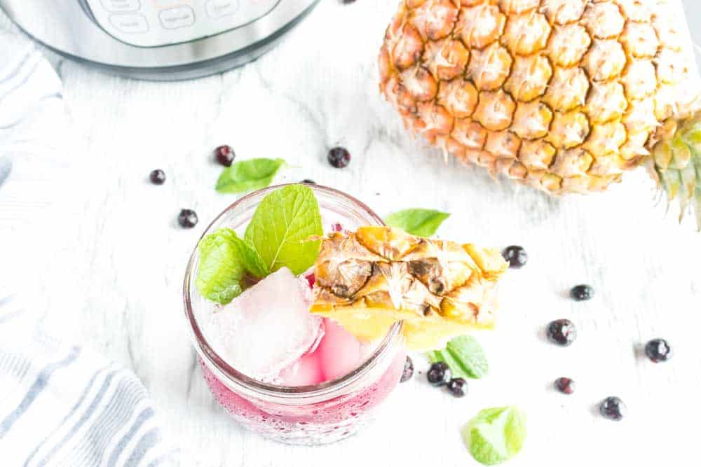 Instant Pot Pineapple Blueberry Fruit Infused Water Recipe- Making Fruit Infused Water in your Instant Pot has never been easier! The combination of pineapple and blueberry is incredible and refreshing. #infusedwater #instantpot #pressurecooker #blueberry #pineapple #easy #best #delicious #homefreshideas