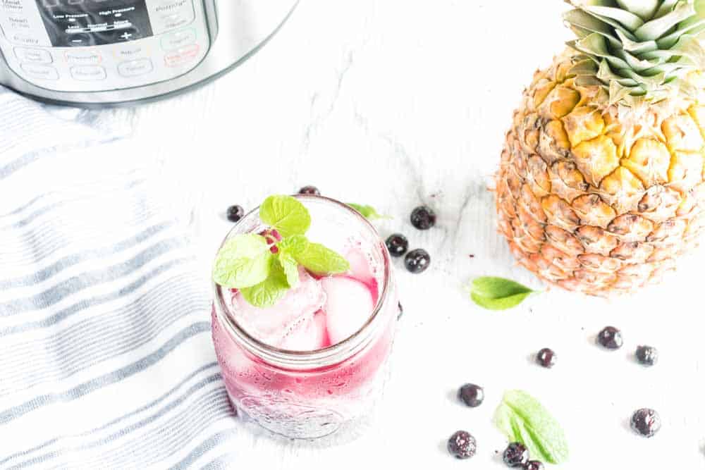 Instant Pot Pineapple Blueberry Fruit Infused Water Recipe- Making Fruit Infused Water in your Instant Pot has never been easier! The combination of pineapple and blueberry is incredible and refreshing. #infusedwater #instantpot #pressurecooker #blueberry #pineapple #easy #best #delicious #homefreshideas