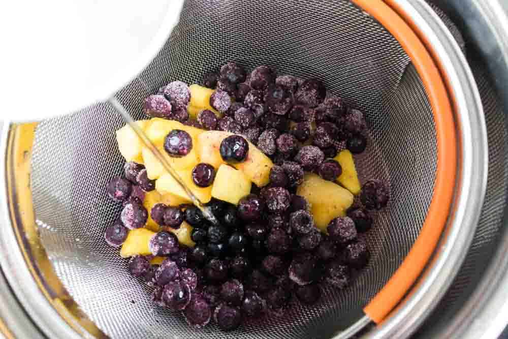 Instant Pot Pineapple Blueberry Fruit Infused Water Recipe- Making Fruit Infused Water in your Instant Pot has never been easier! The combination of pineapple and blueberry is incredible and refreshing. #infusedwater #instantpot #pressurecooker #blueberry #pineapple #easy #best #delicious #homefreshideas