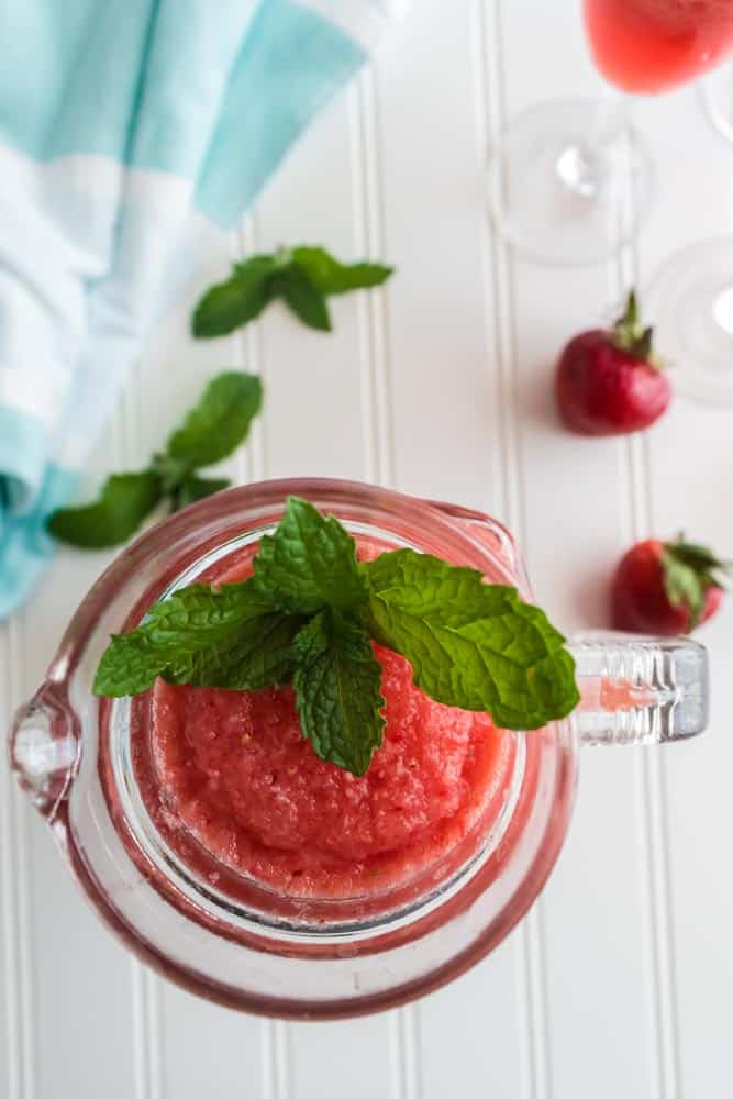 Boozy Strawberry Watermelon Drink Recipe - This delicious Watermelon Drink has a little bit of everything. Tangy limeade, strawberries, watermelon, and tequila create an irresistible drink! #watermelon #slush #drink #cocktail #margarita #homefreshideas