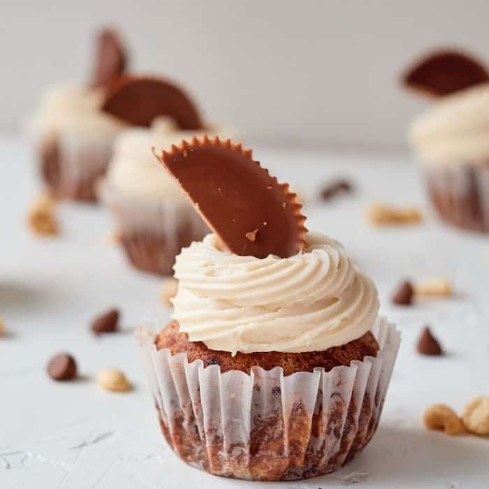Ultimate Double Peanut Butter Cupcakes with Chocolate Chips - These are super rich, decadent and delicious Double Peanut Butter Cupcakes! They are garnished with Reece's Peanut Butter cups and are a crowd pleaser. #cupcakes #dessert #easy #peanutbutter #chocolate #homefreshideas