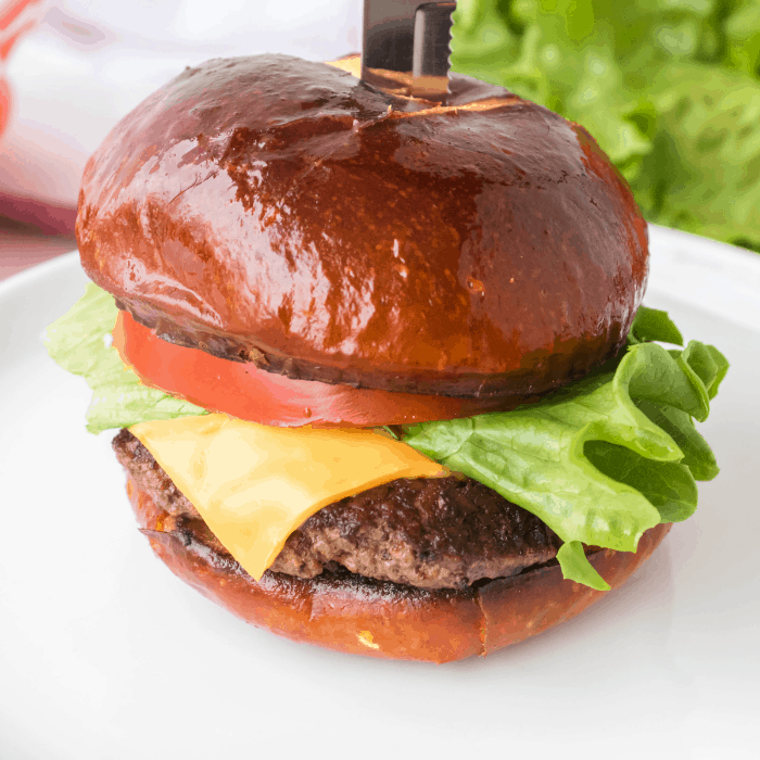 smash burger with a knife in the bun