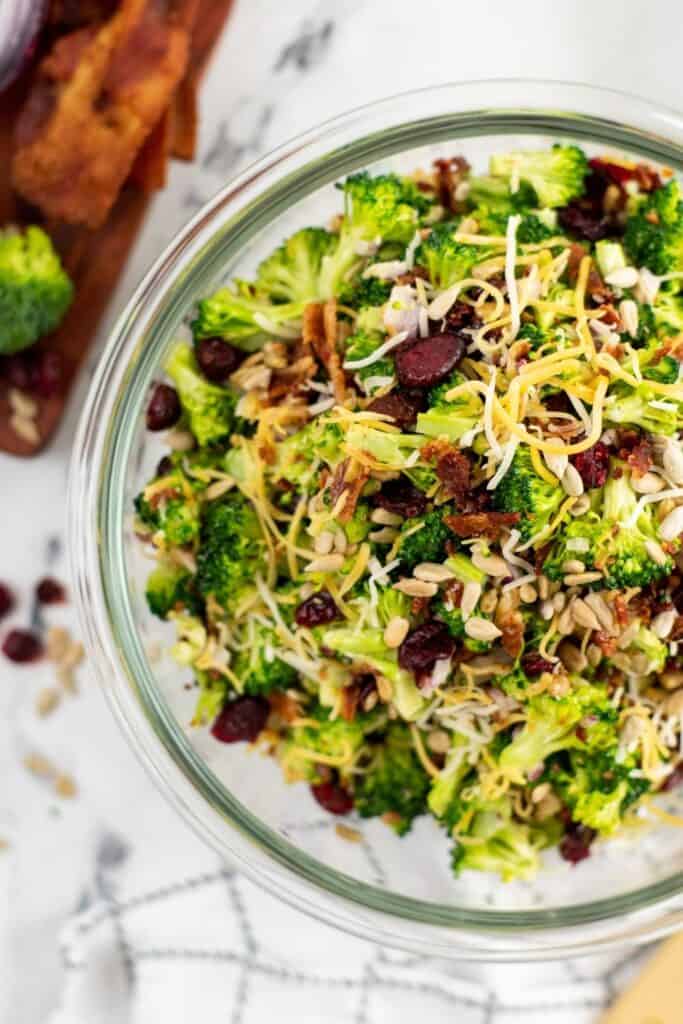 overhead shot of broccoli salad in a bowl on counter 