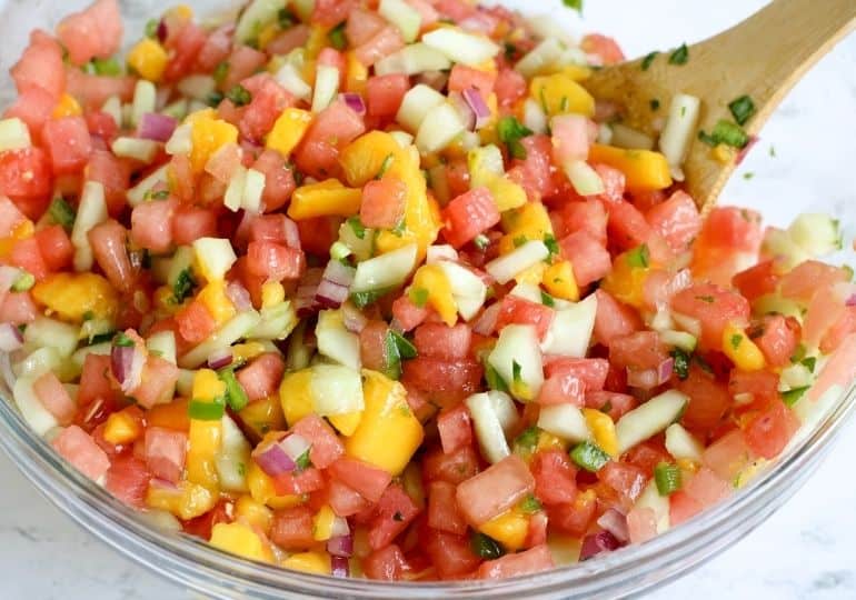 bowl of watermelon salsa with spoon in it