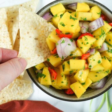 bowl with mango salsa and chip
