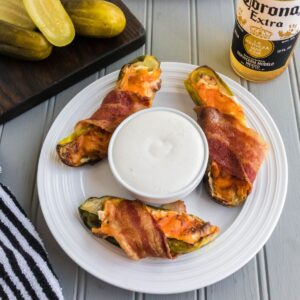 three bacon wrapped pickles