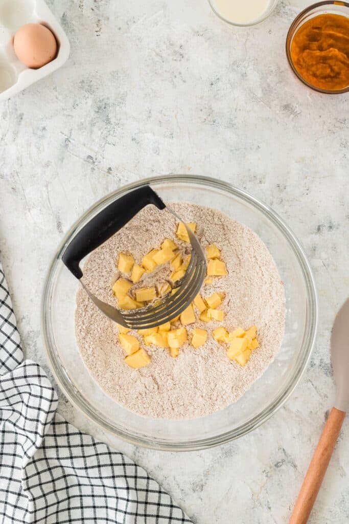 adding butter to dry ingredients