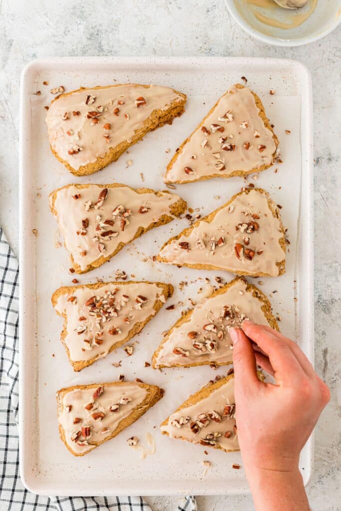 adding nuts to spiced pumpkin scones