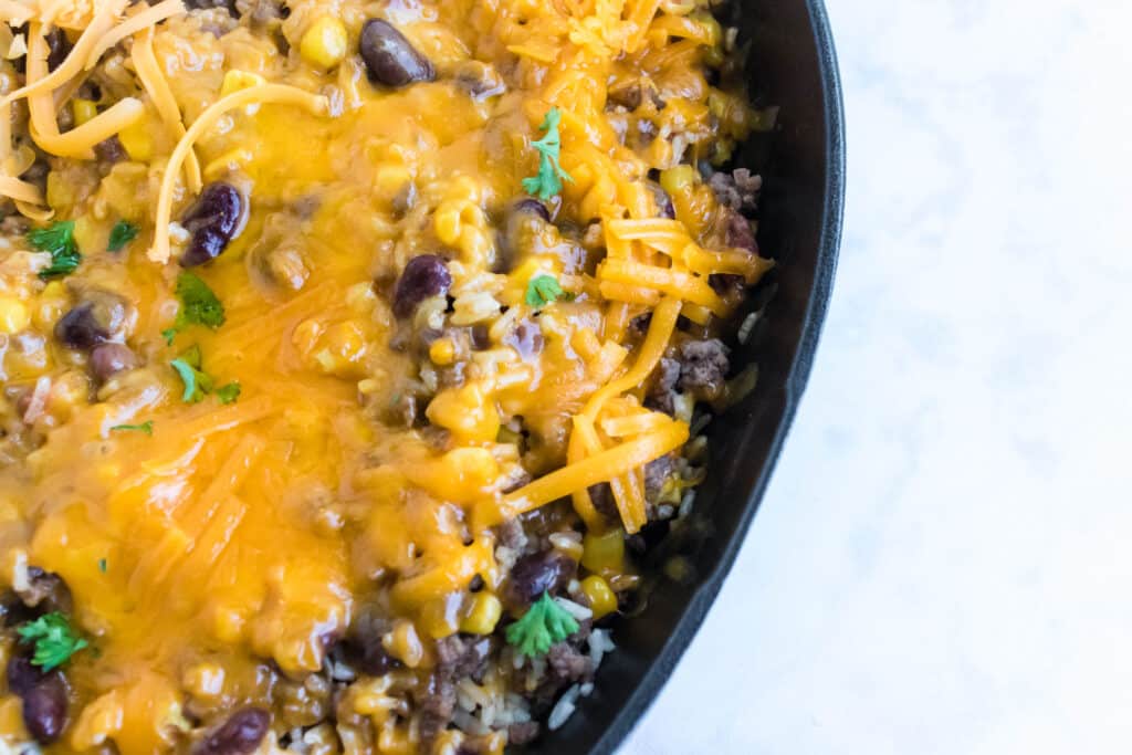 cheesy taco skillet in a cast iron skillet