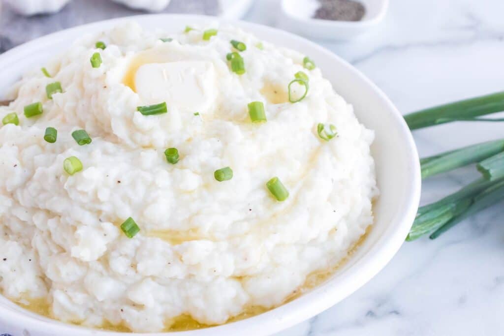 instant pot garlic mashed potatoes in a white bowl