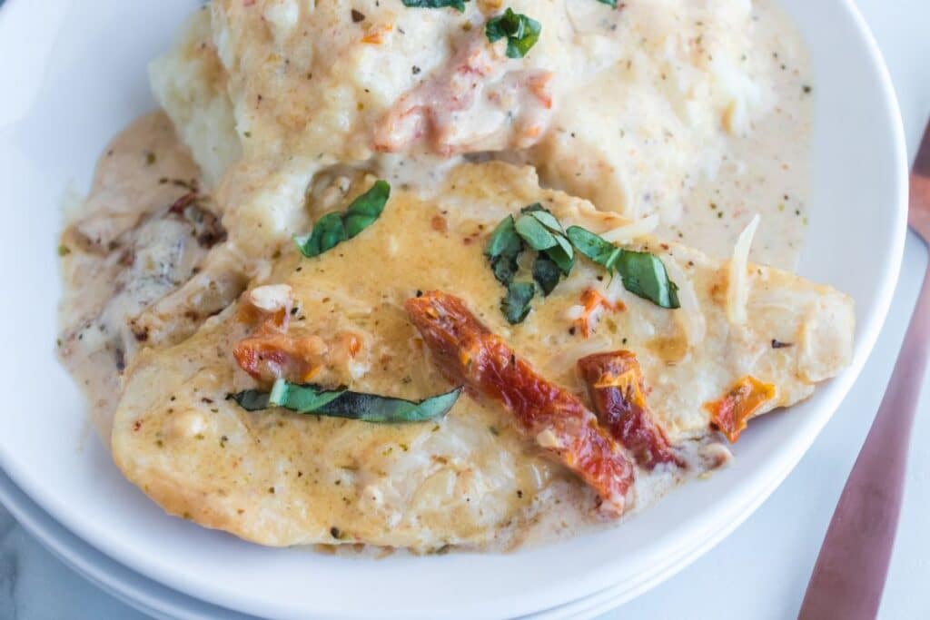 plate with mashed potatoes and italian chicken