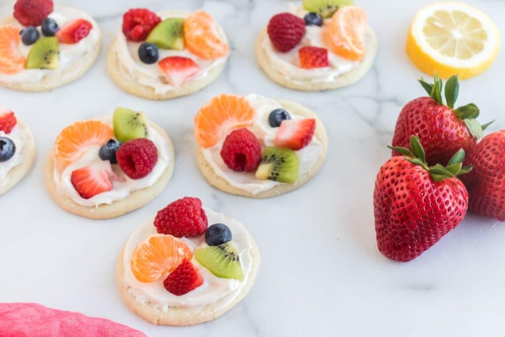 sugar cookies decorated with icing and fruit