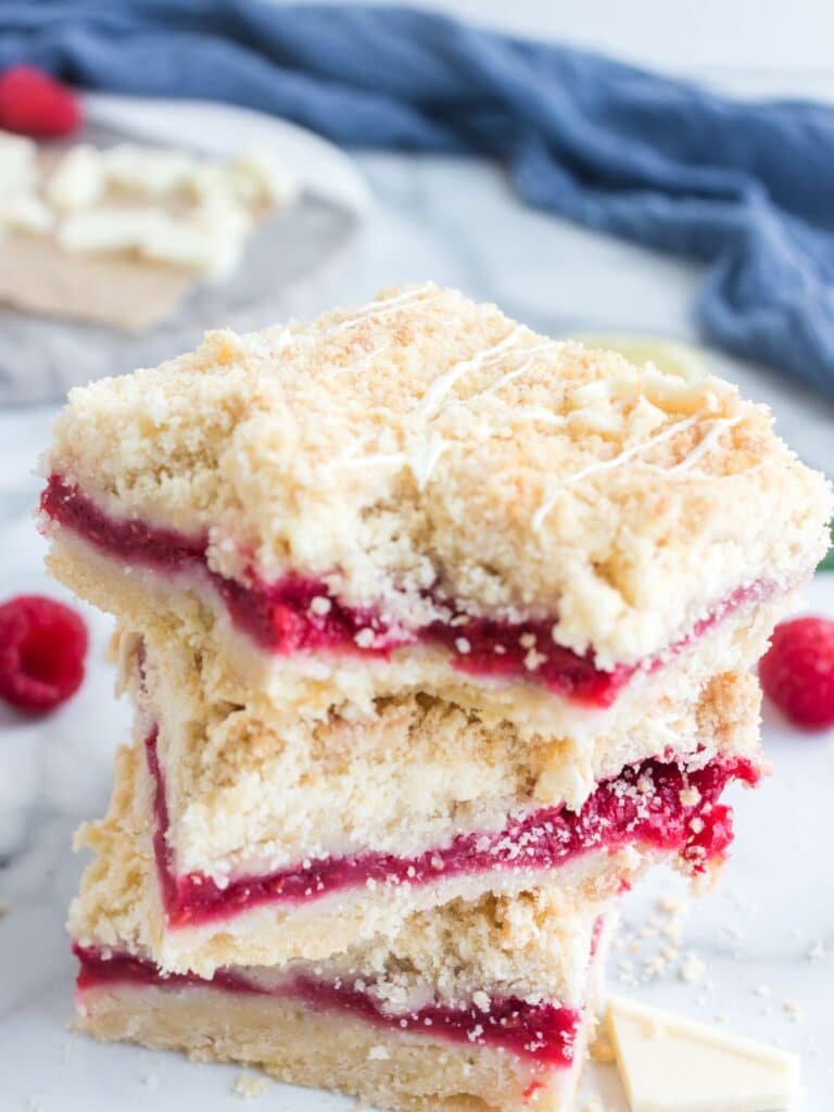 raspberry shortbread jam bars with bite out of them