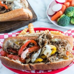 shredded beef sandwich in red basket