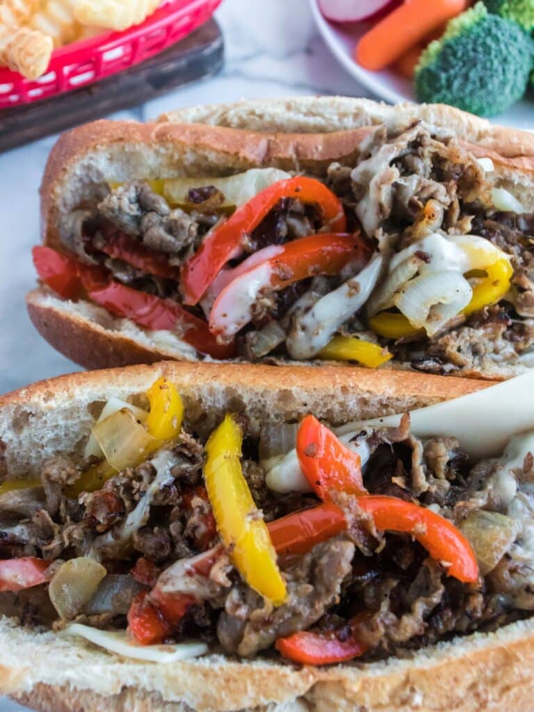 cast iron philly cheesesteaks ready to serve