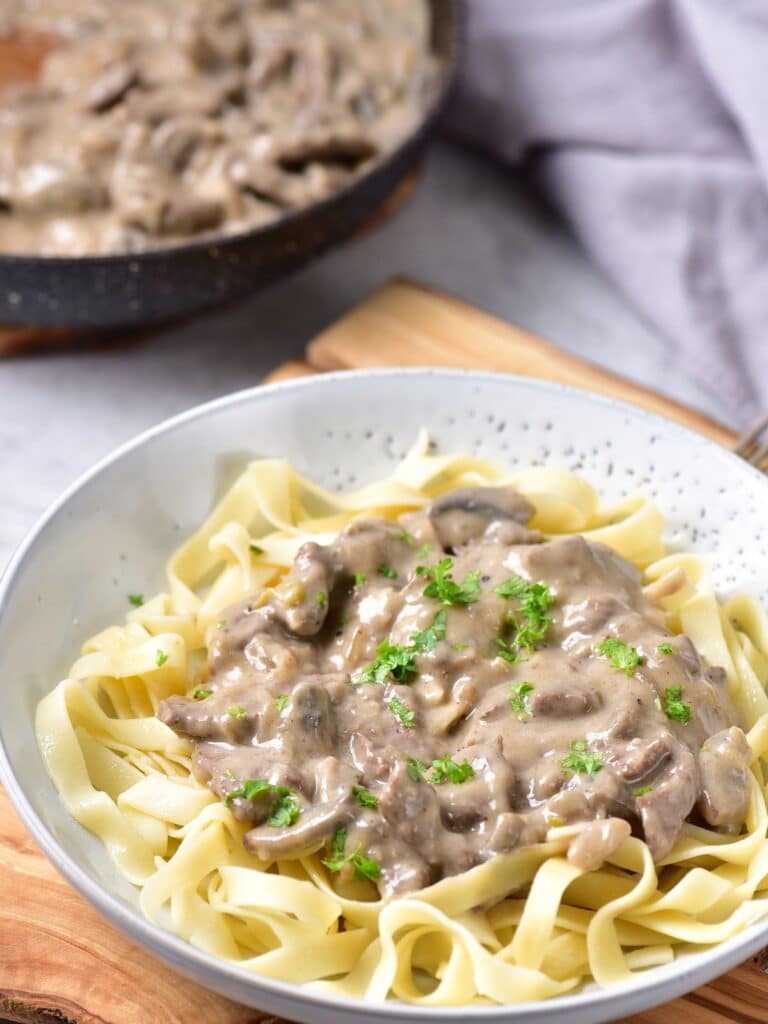 bowl with creamy beef stroganoff and noodles