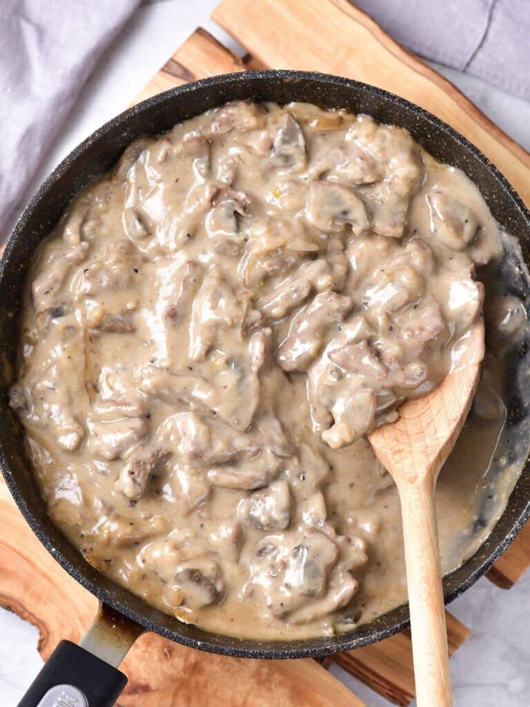 overhead shot of skillet with wooden spoon